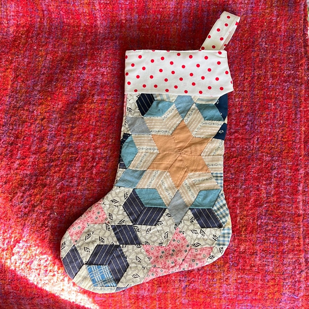 Quilted Christmas stocking. Handcrafted with love. It has a lovely vintage Look.